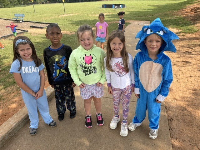 students in pjs on the playground
