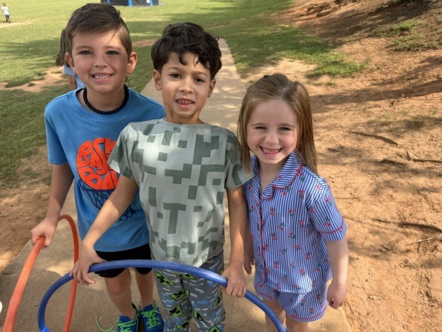 students in pjs on the playground