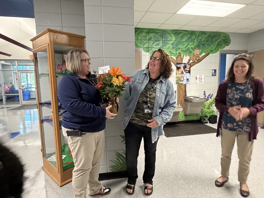 Lisa Dunagin surprising Angie Wells with flowers