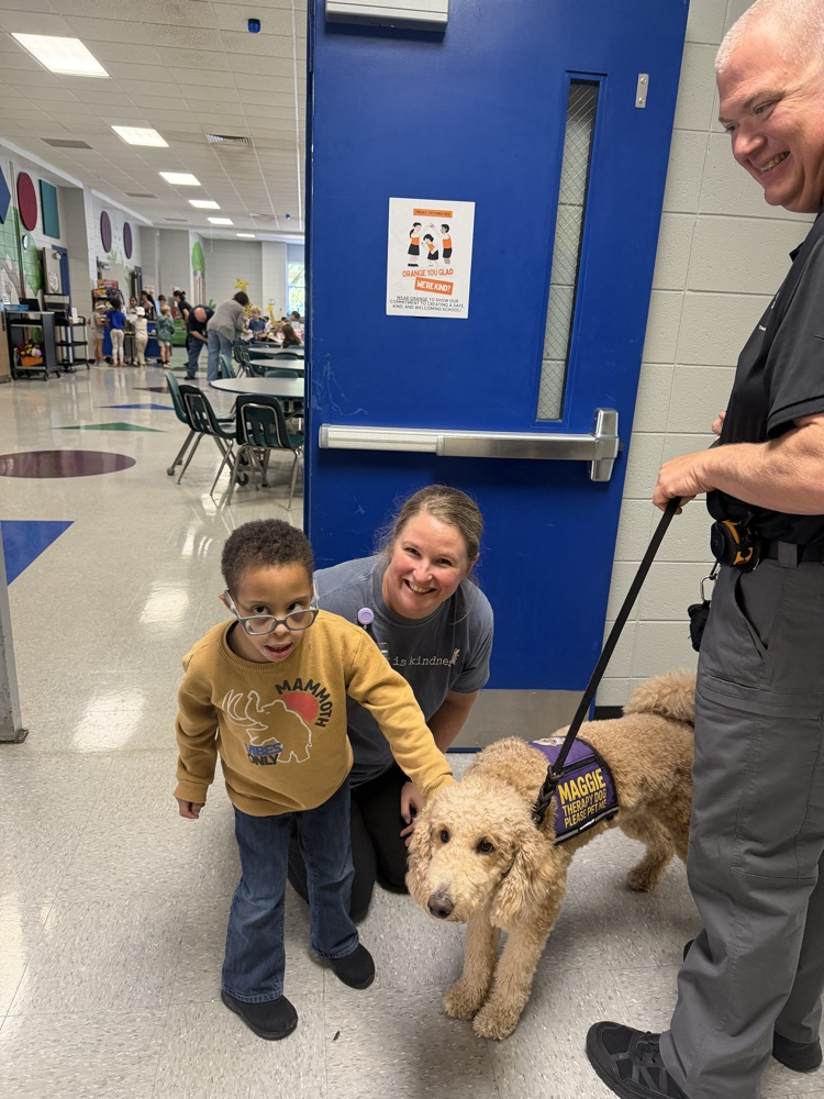 K9 Maggie greeting students