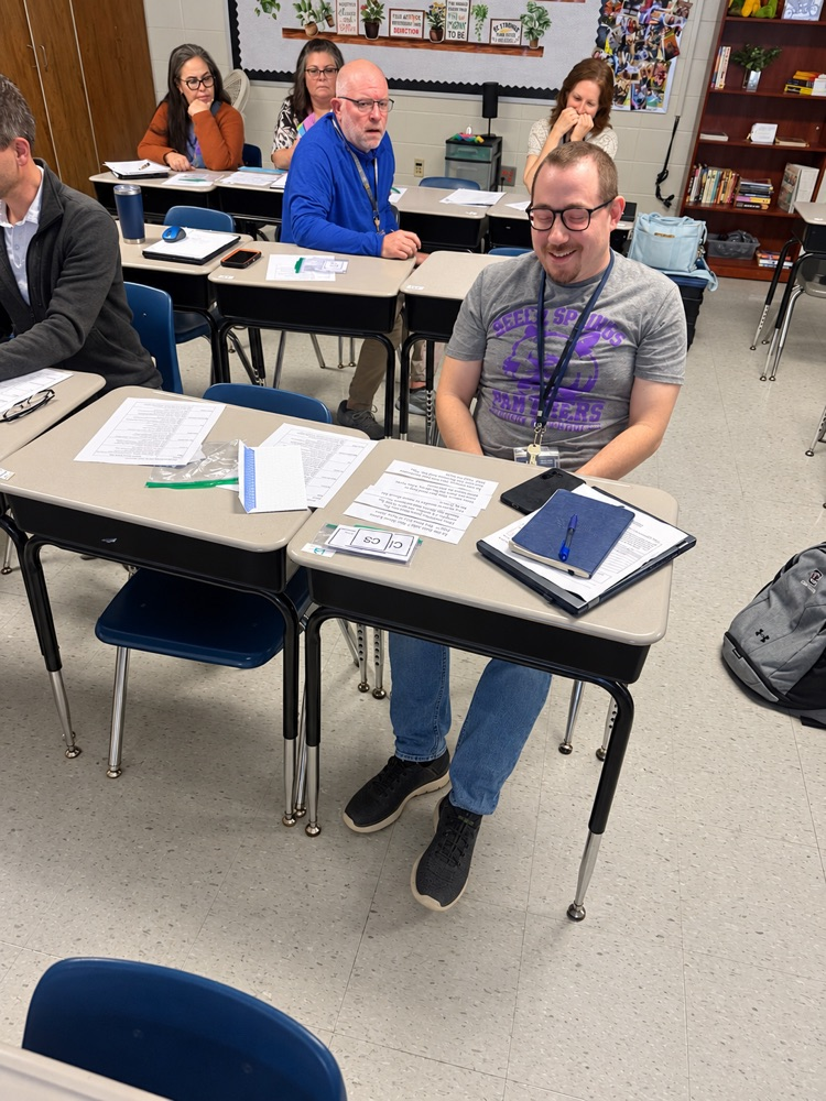 teacher at desk