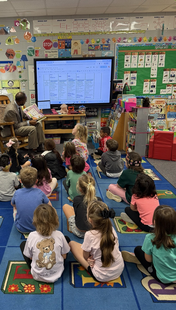 Dr. Gary reading to a class of K5 students