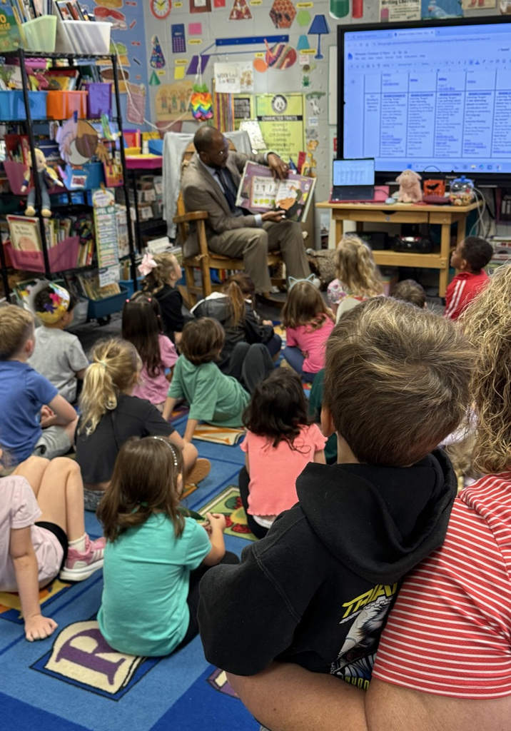 Dr. Gary reading to a class of K5 students