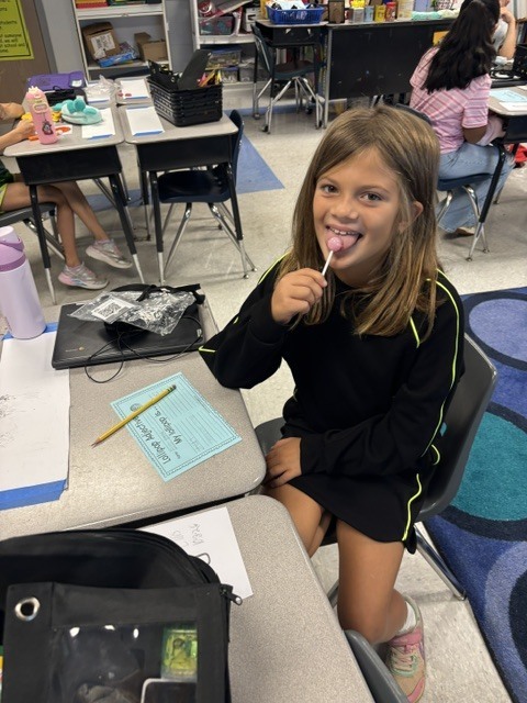 students tasting candy and describing