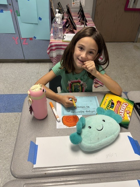 students tasting candy and describing it on paper