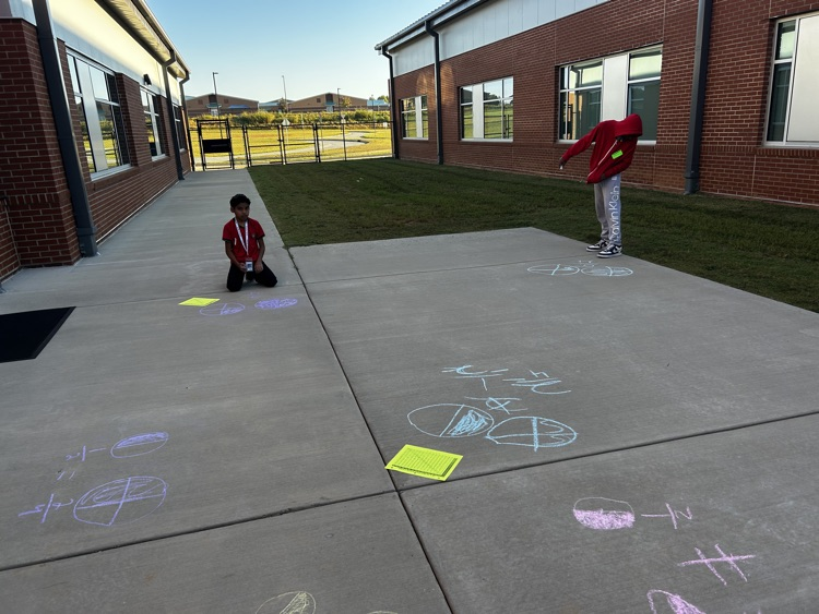 kids with chalk doing math