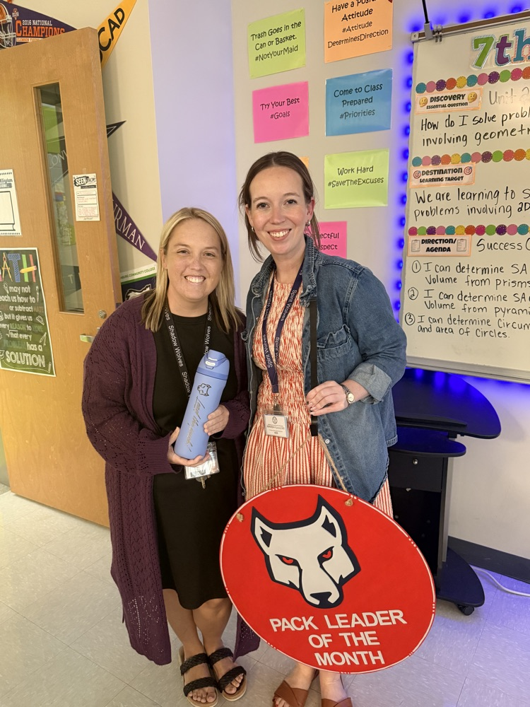 Ms Dillingham and her leader of the month sign