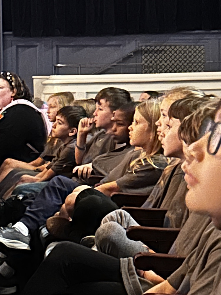 students sitting in theater audience