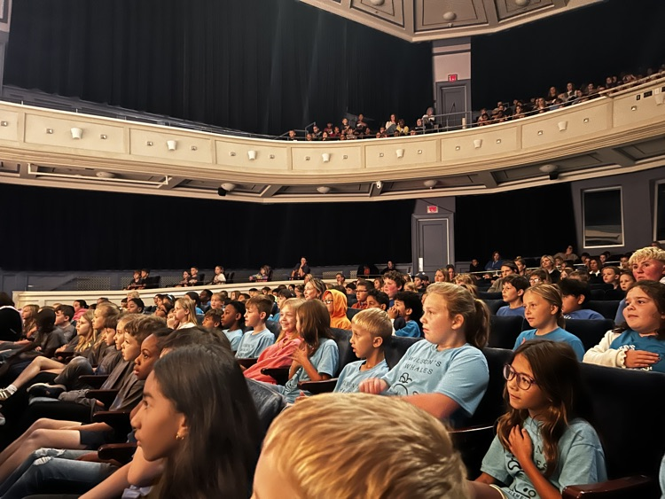 students sitting in theater audience