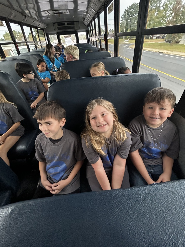students sitting on bus