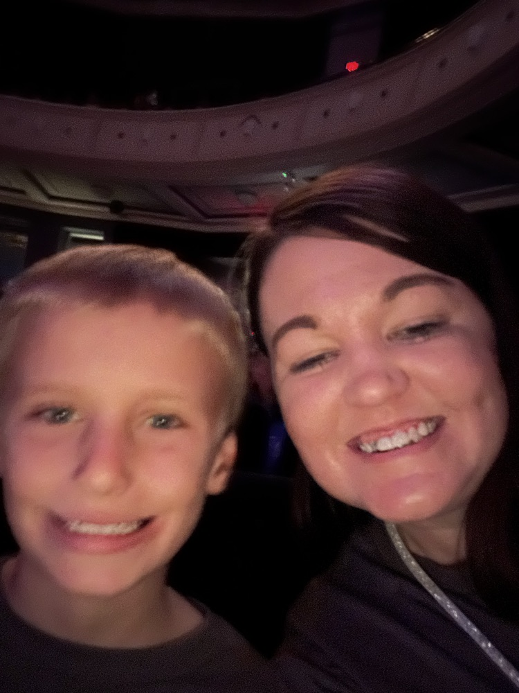 student and teacher smiling