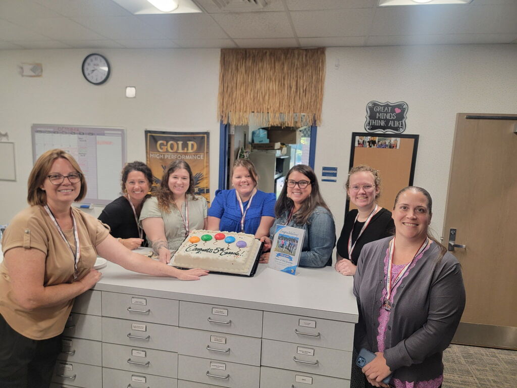 fifth grade team with a cake