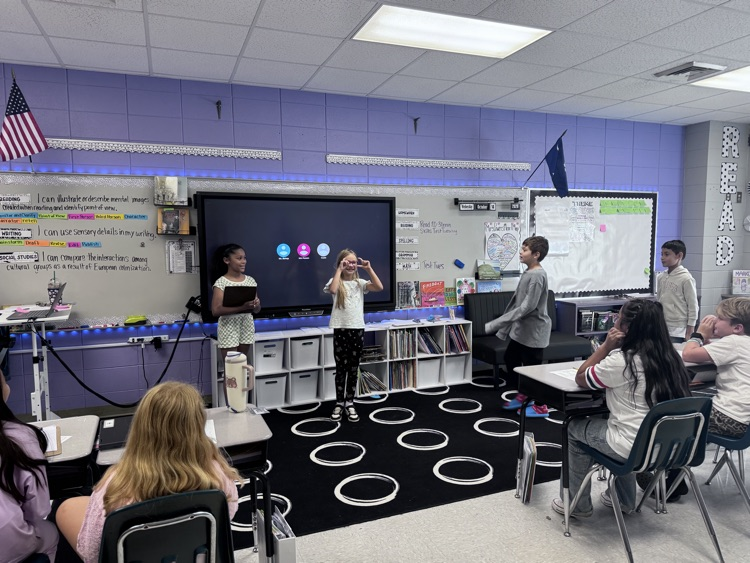 students presenting in class