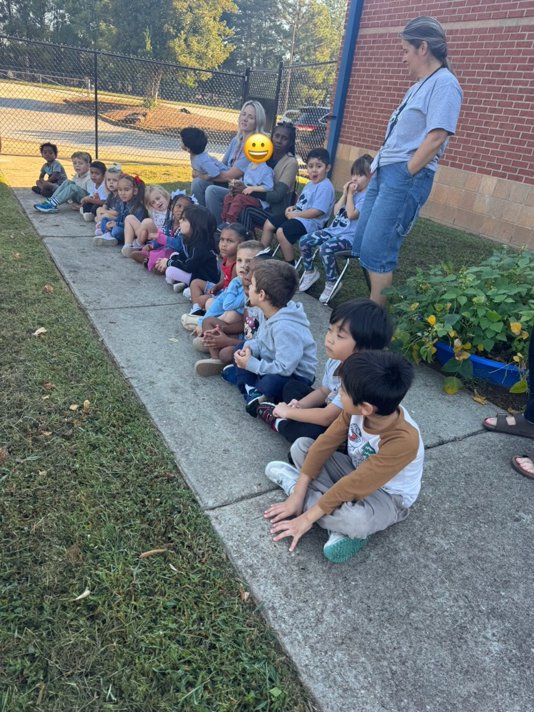 students learning about the lifecycle of pumpkins and apples