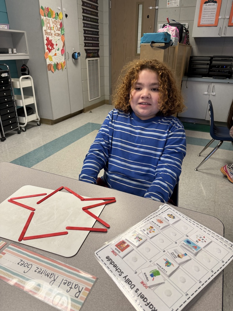 students building with popsicle sticks 