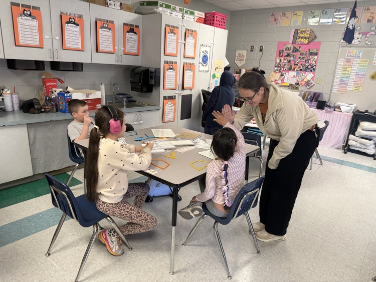 students building with popsicle sticks 