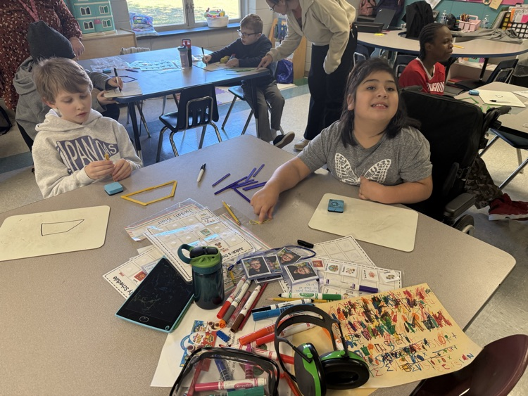 students building with popsicle sticks 