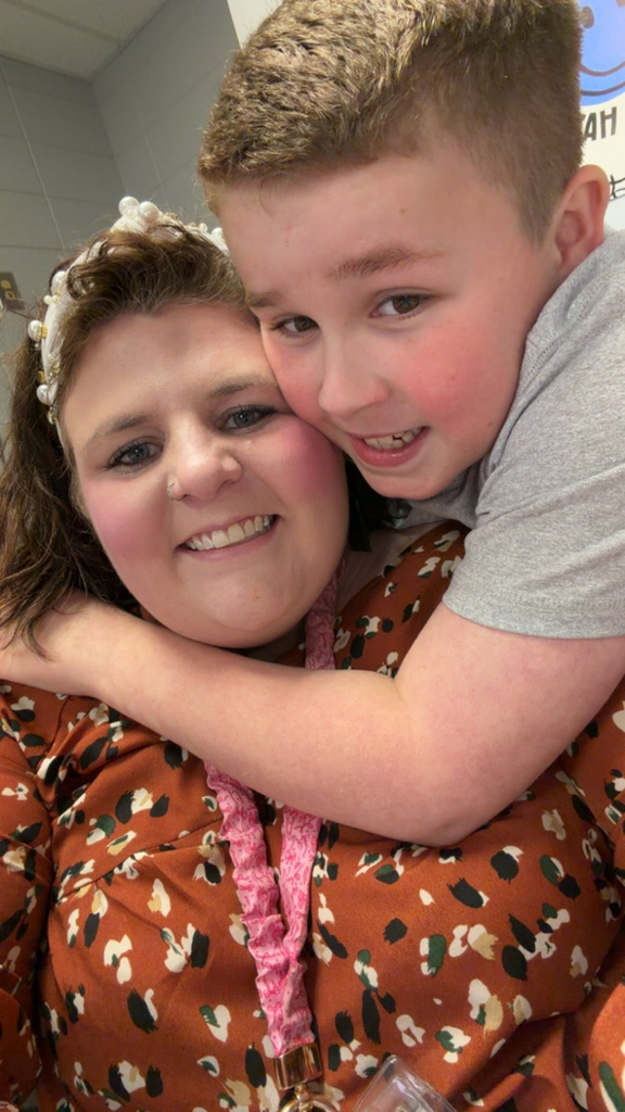 student and teacher smiling 