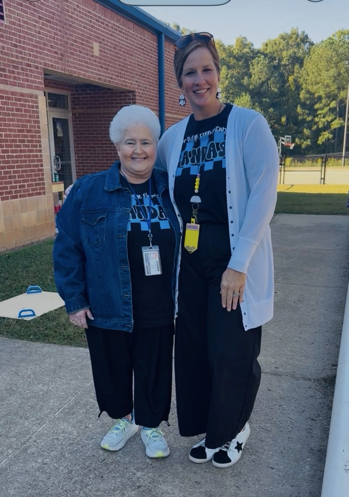two women wearing the same t-shirts 