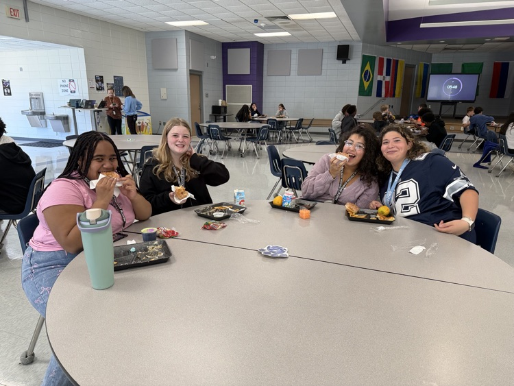 students eating donuts 