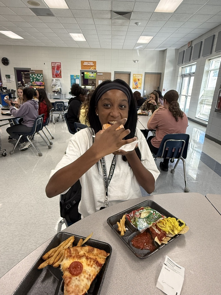student eating donuts 