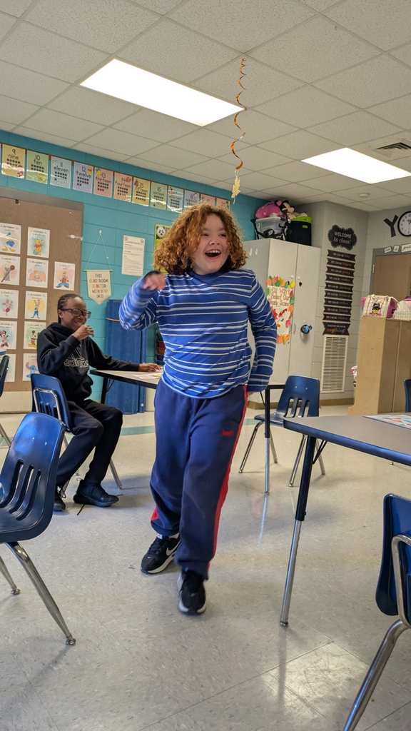 students pulling shapes out of a bucket to match