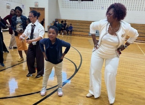 Staff and student dancing