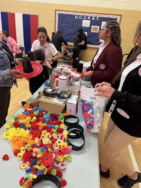 Staff and students at table