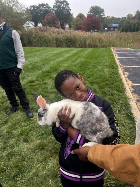 Student with a rabbit.