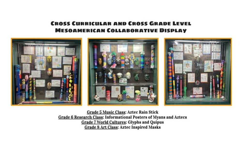 displays of art projects by students in three glass  cases