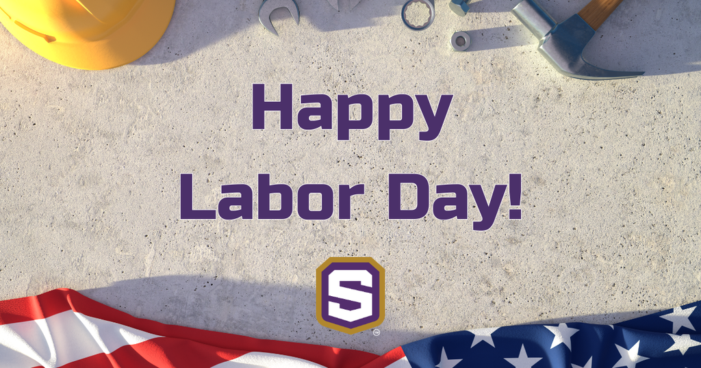 A construction helmet, tools, and an American flag lie on a concrete surface. Text reads "Happy Labor Day!" with a Spencer logo.