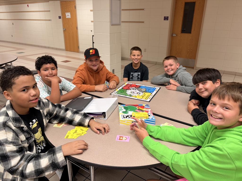 A group of middle school students playing games.