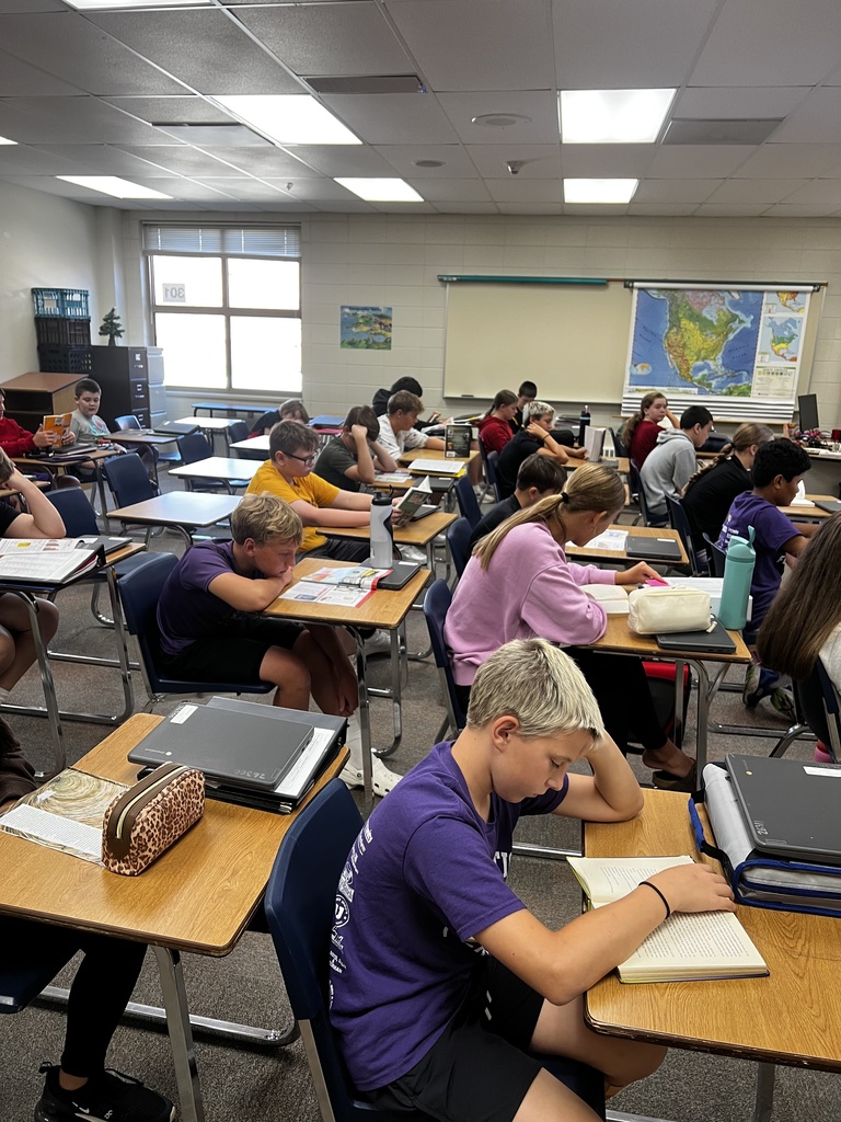Students reading books in class.