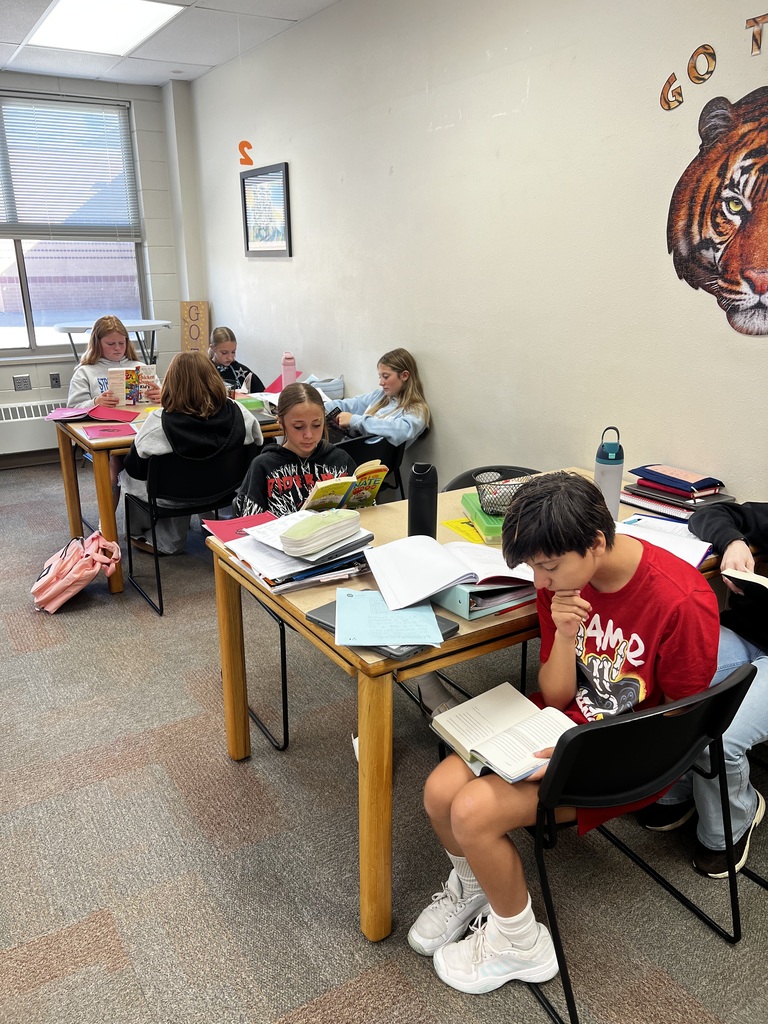 Students reading books in class.