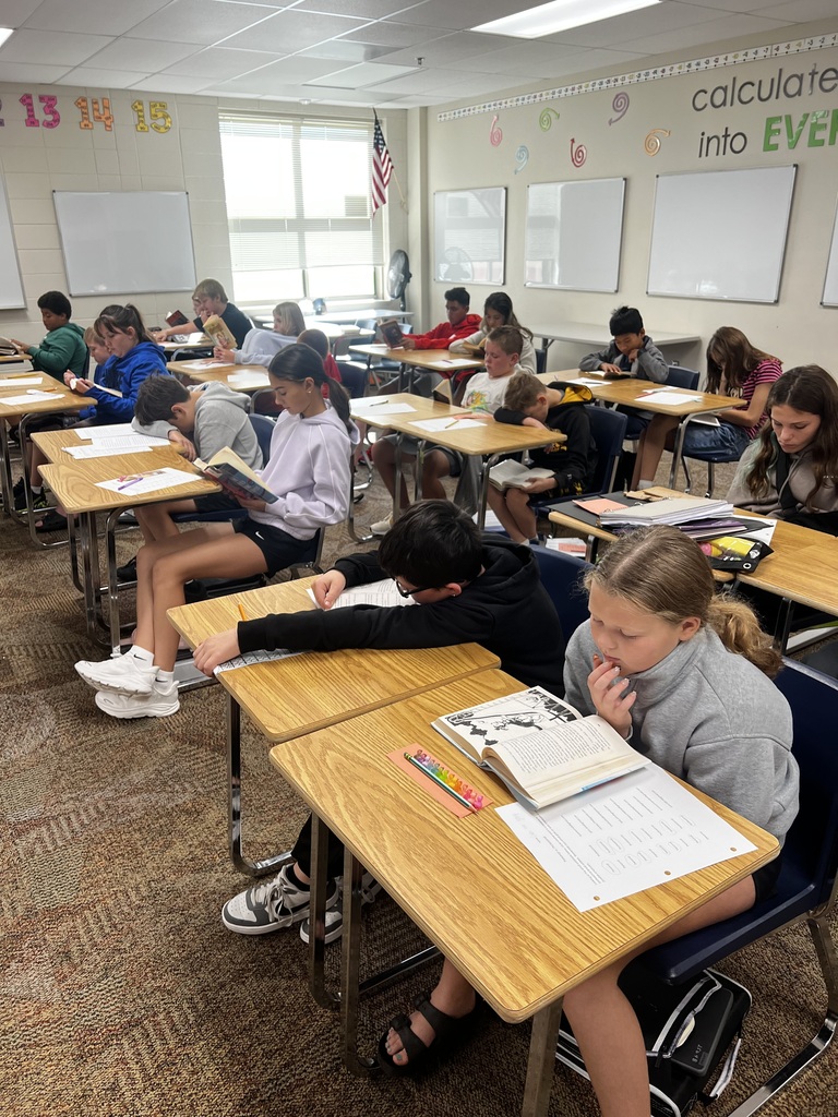 Students reading books in class.