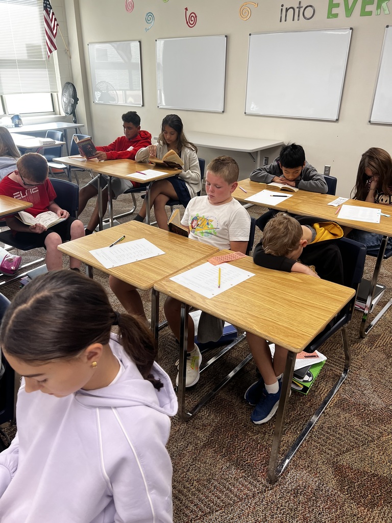 Students reading books in class.