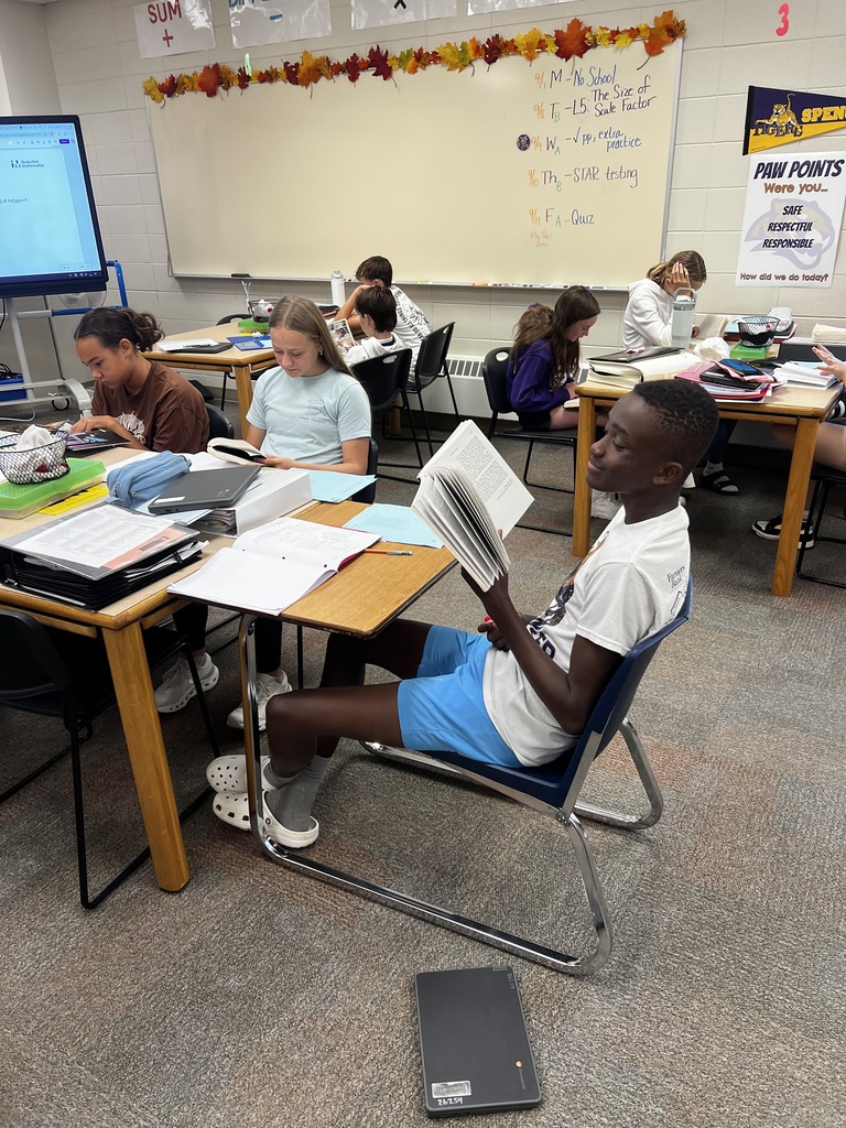 Students reading books in class.