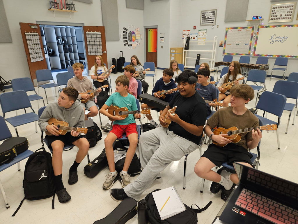 Students playing Ukuleles