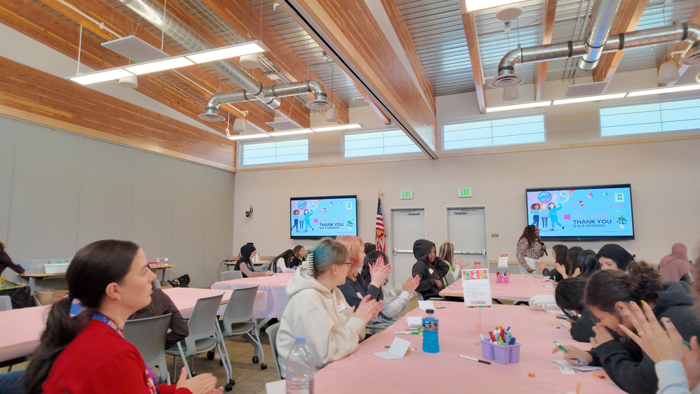 High school students applaud a guest speaker
