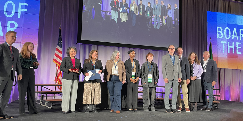 SPS board members on stage accepting award