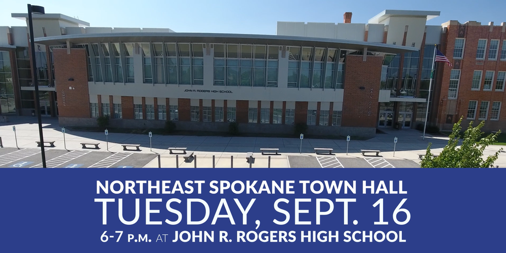 Photo of a high school building with the text Northeast Spokane Town Hall Tuesday, Sept. 16, 6-7 p.m. at John R. Rogers High School