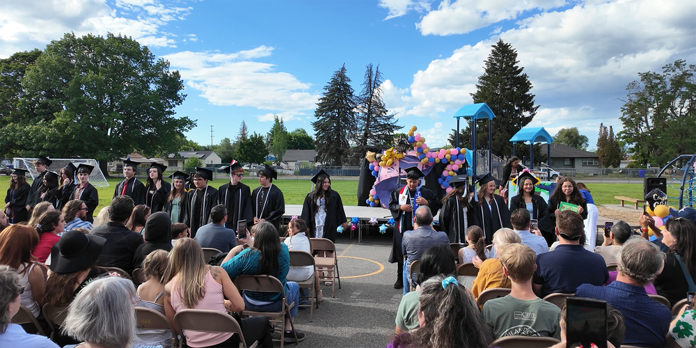 Ruben Trejo Dual Language Academy graduates line up at a ceremony.
