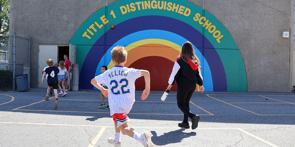 Kid running outside school