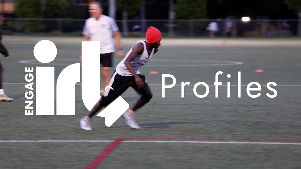 A high school student runs on a soccer field. Text is Engage IRL Profiles.