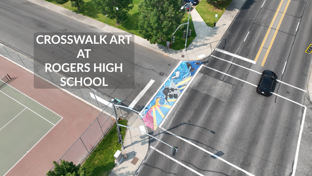 Overhead view of a mural painted in a crosswalk