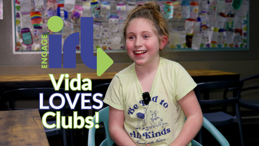 A smiling 3rd grader with the text Engage IRL: Vida LOVES Clubs!