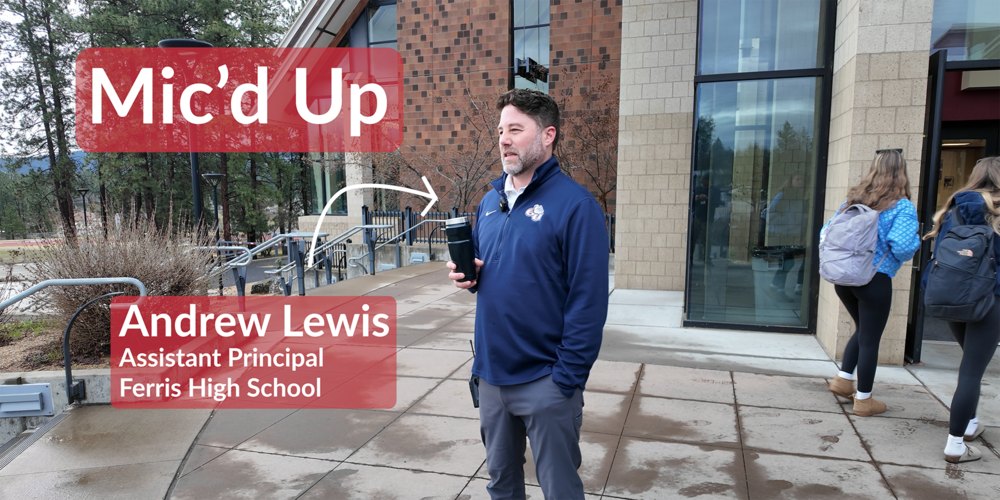 Ferris High School Assistant Principal Andrew Lewis is "mic'd up" as he greets students outside the school building.