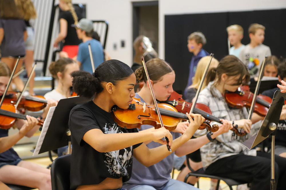 Sacajawea Middle School orchestra students perform in the gym.