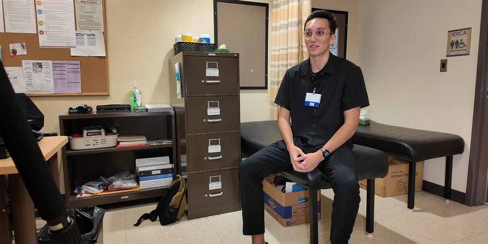 School nurse Aidan McCrum sits in his office.