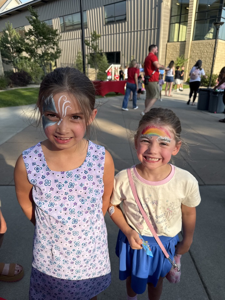 Two students smiling